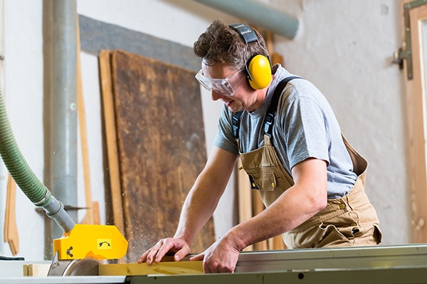 Man Working with Earmuffs